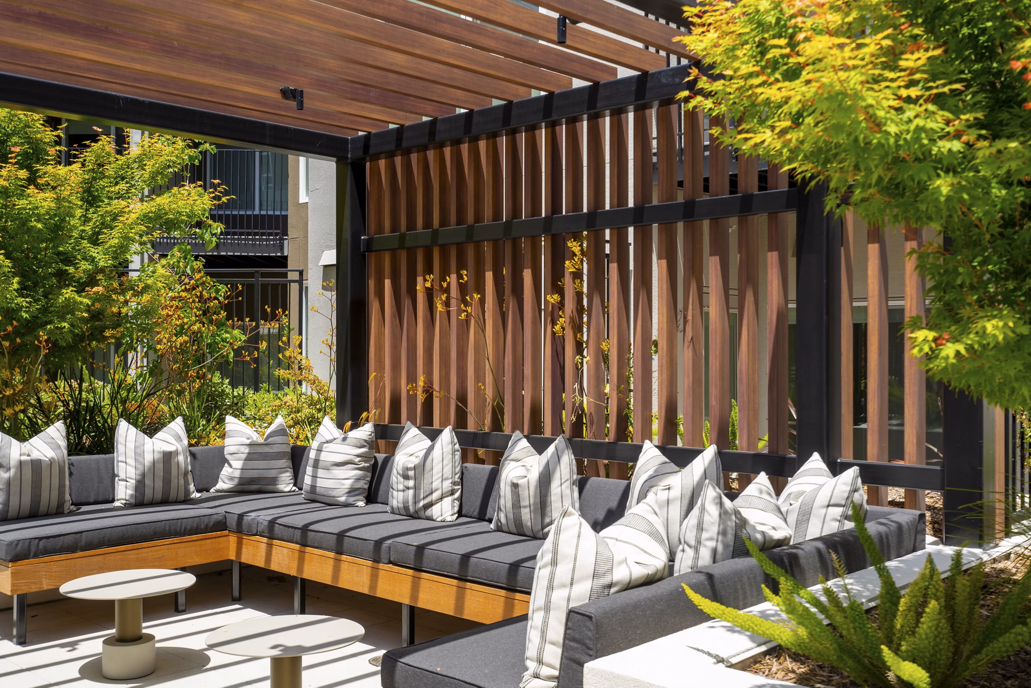 Courtyard featuring lush landscaping and seating at The Hayden Apartments