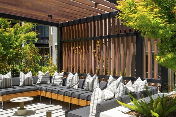 Courtyard featuring lush landscaping and seating at The Hayden Apartments