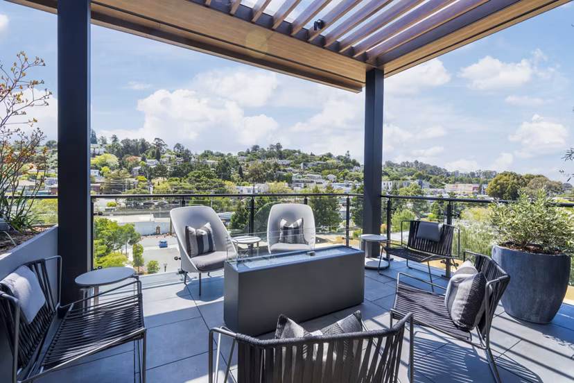 Fire pit lounge area at The Hayden Apartments featuring comfortable seating and ambient lighting