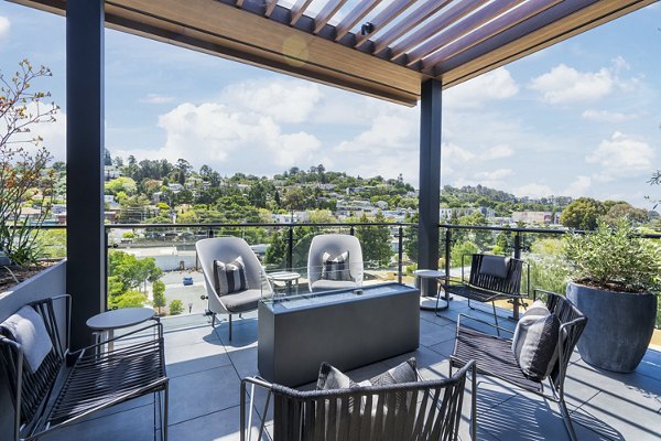 Fire pit lounge area at The Hayden Apartments featuring comfortable seating and ambient lighting