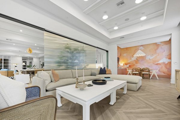 Clubhouse with modern decor and seating at Elan Polo Gardens Apartments
