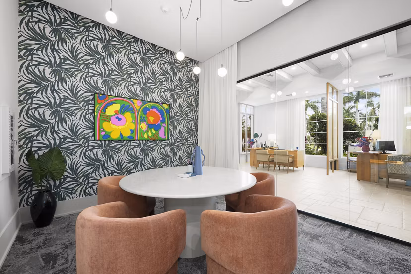 Elan Polo Gardens: Elegant clubhouse with modern dÃ©cor and seating areas at luxury apartments in Louisville