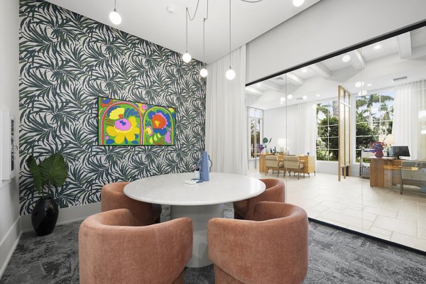 Elan Polo Gardens: Elegant clubhouse with modern dÃ©cor and seating areas at luxury apartments in Louisville