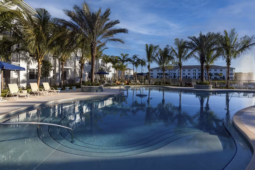 Resort-style pool at Elan Polo Gardens Apartments offering luxury relaxation and outdoor leisure amenities in a serene environment