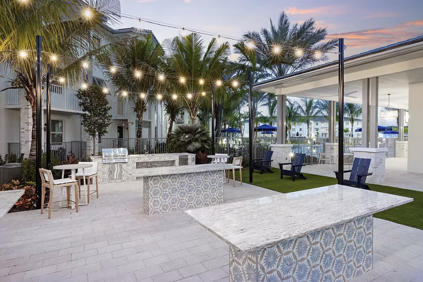 Courtyard with lush landscaping at Elan Polo Gardens Apartments offering serene outdoor spaces for relaxation