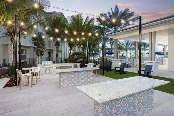 Courtyard with lush landscaping at Elan Polo Gardens Apartments offering serene outdoor spaces for relaxation