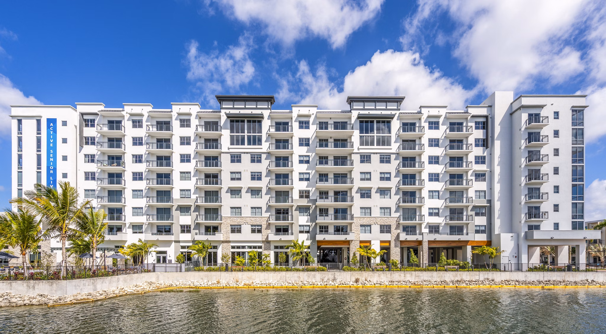 Overture Doral Apartments: Modern luxury building with vibrant landscaping in Miami