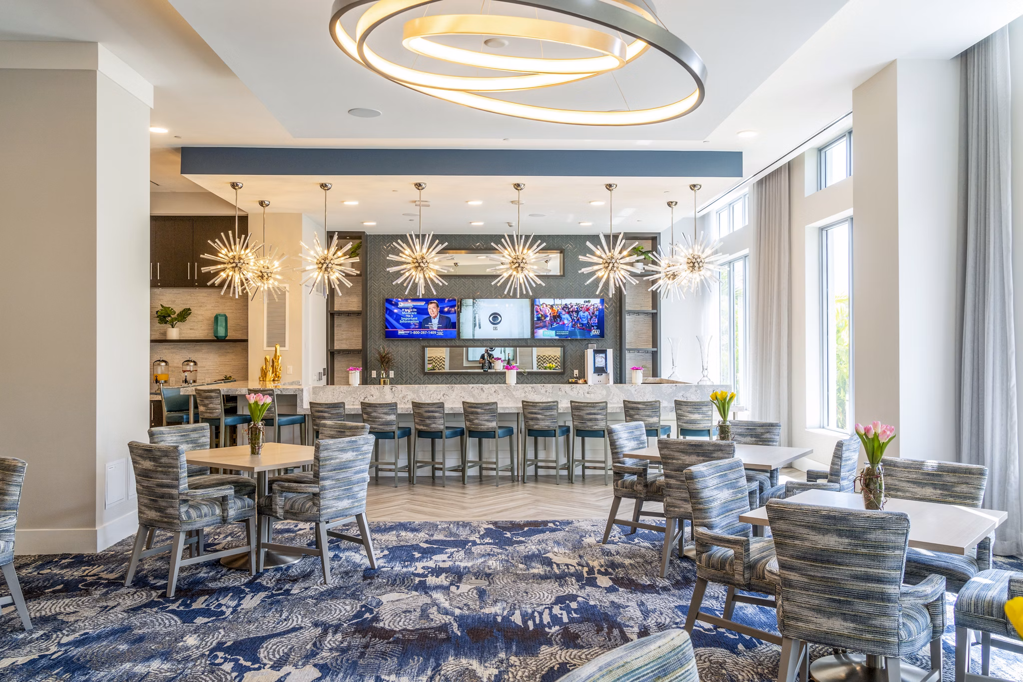 Spacious clubhouse featuring contemporary lobby design at Overture Doral Apartments