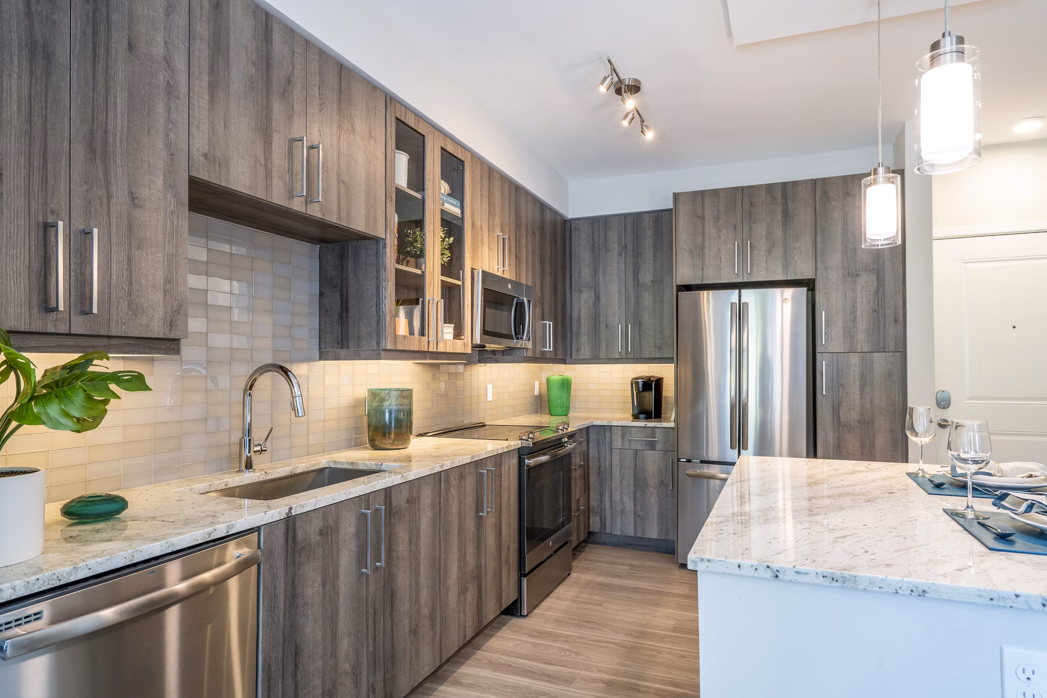 Modern kitchen with sleek countertops and stainless steel appliances at Overture Doral Apartments