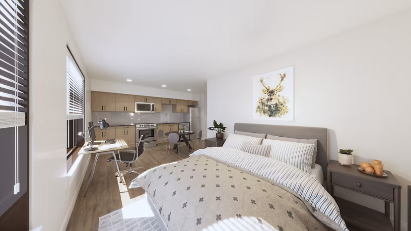 Bedroom with elegant decor and large windows at Hagert and York Apartments, offering luxurious living in a Greystar community