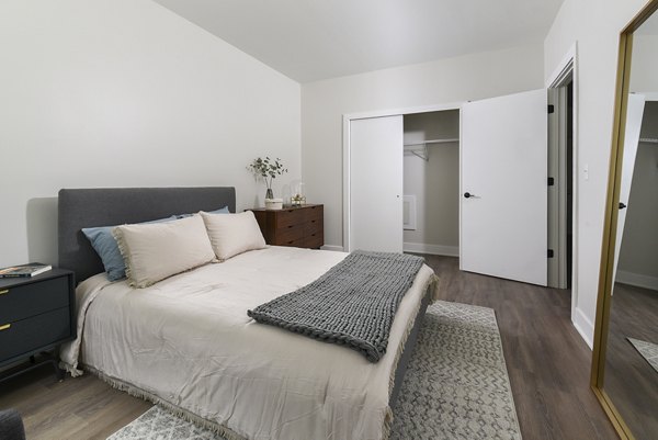Cozy bedroom with stylish decor at Hagert and York Apartments, featuring luxury finishes and modern design