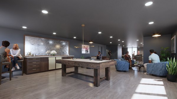 Modern clubhouse with lounge seating and fireplace at Hagert and York Apartments