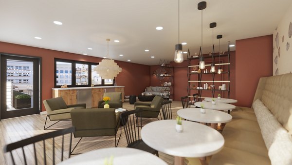 Modern clubhouse featuring cozy seating and stylish decor at Hagert and York Apartments, a Greystar luxury community in a vibrant neighborhood