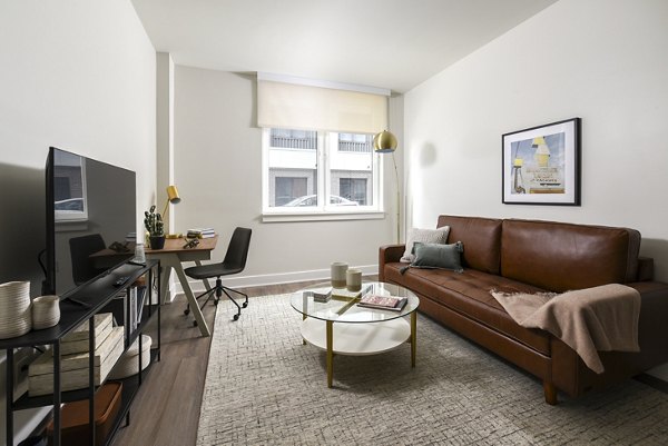 Spacious living room with modern decor in Hagert and York Apartments