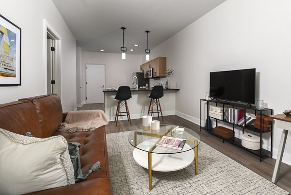 Spacious living room with contemporary furnishings at Hagert and York Apartments