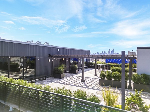 Outdoor seating area with modern patio furniture at Hagert and York Apartments