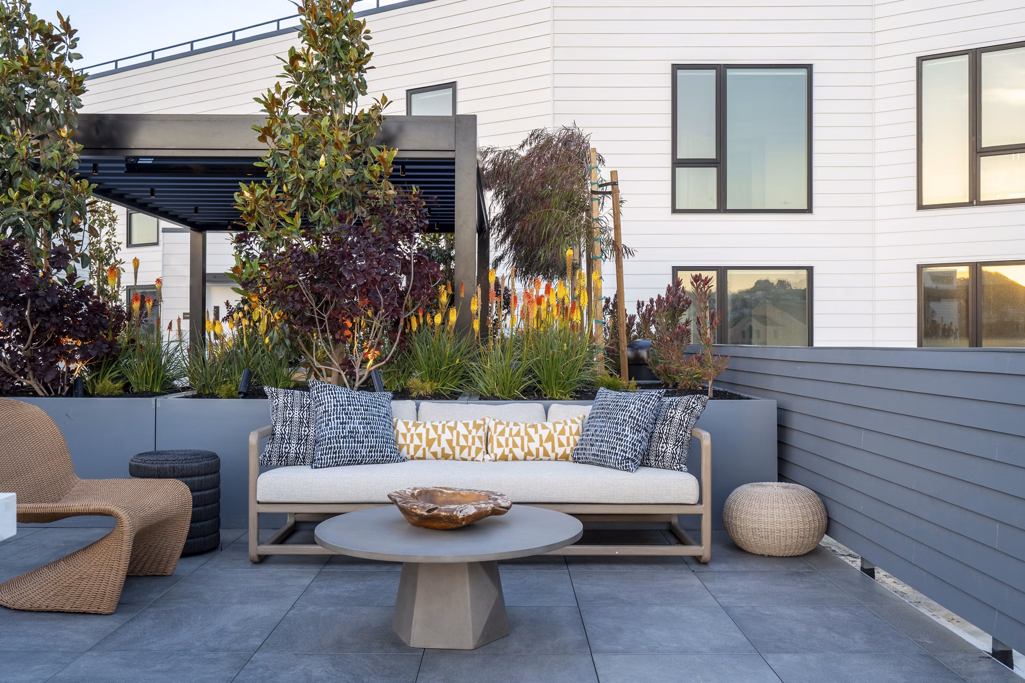 Ventana Residences: Welcoming patio space with cozy seating and greenery in luxury apartments