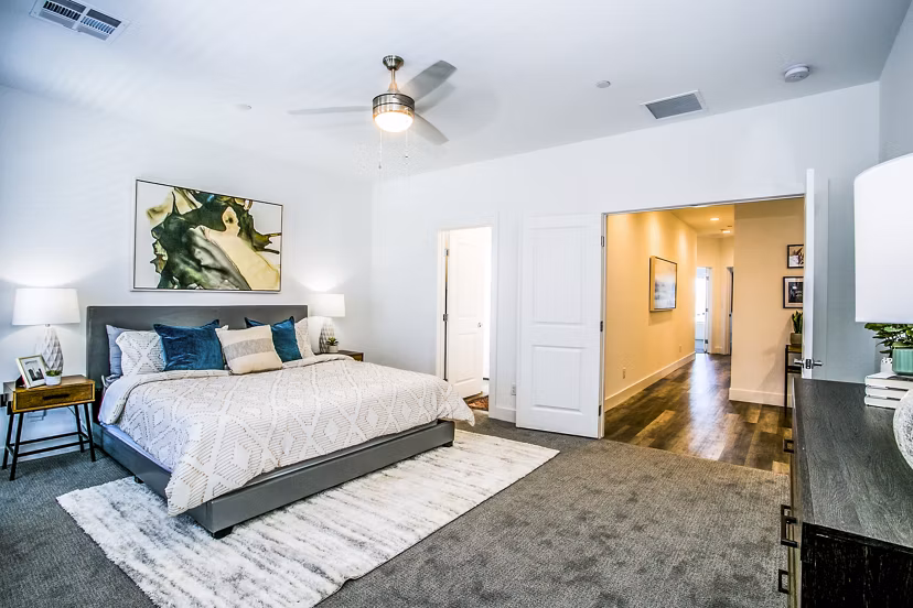 Modern bedroom with elegant decor at Townes at Peace Way Apartments
