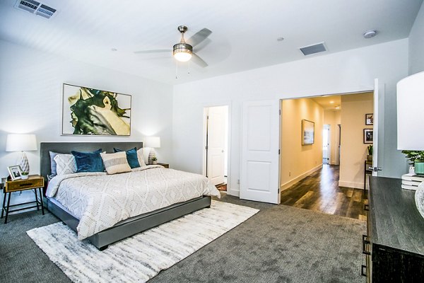 Modern bedroom with elegant decor at Townes at Peace Way Apartments