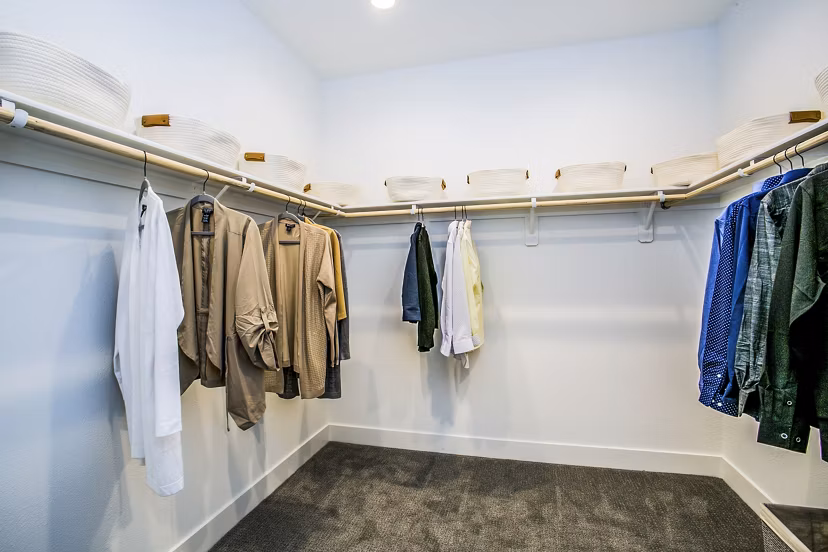 Spacious bedroom closet with custom shelving at Townes at Peace Way Apartments