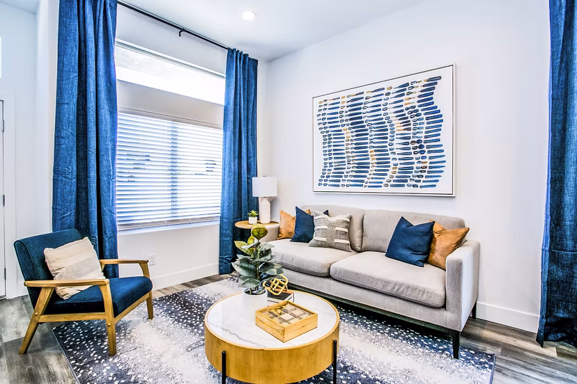 Spacious living room with modern decor in Townes at Peace Way Apartments