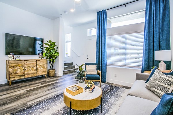 Spacious living room with modern furnishings at Townes at Peace Way Apartments, Greystar luxury apartments in Las Vegas