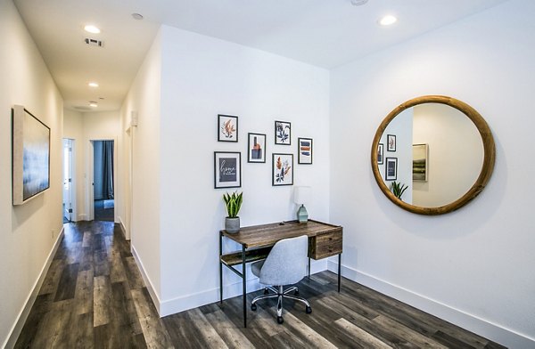Stylish home office in a sleek hallway at Townes at Peace Way Apartments