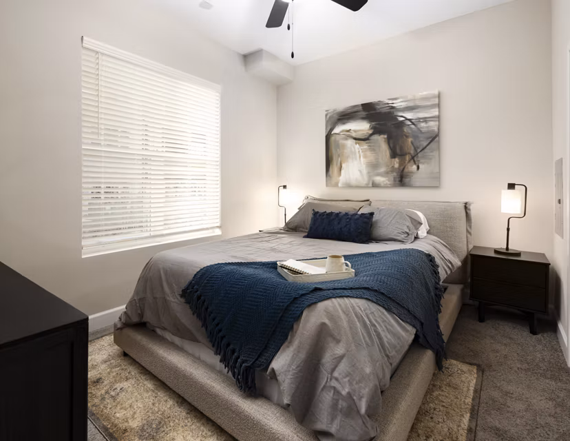 Stylish bedroom with modern decor at The Crossings Apartments