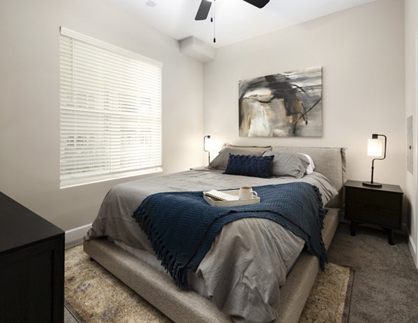Stylish bedroom with modern decor at The Crossings Apartments