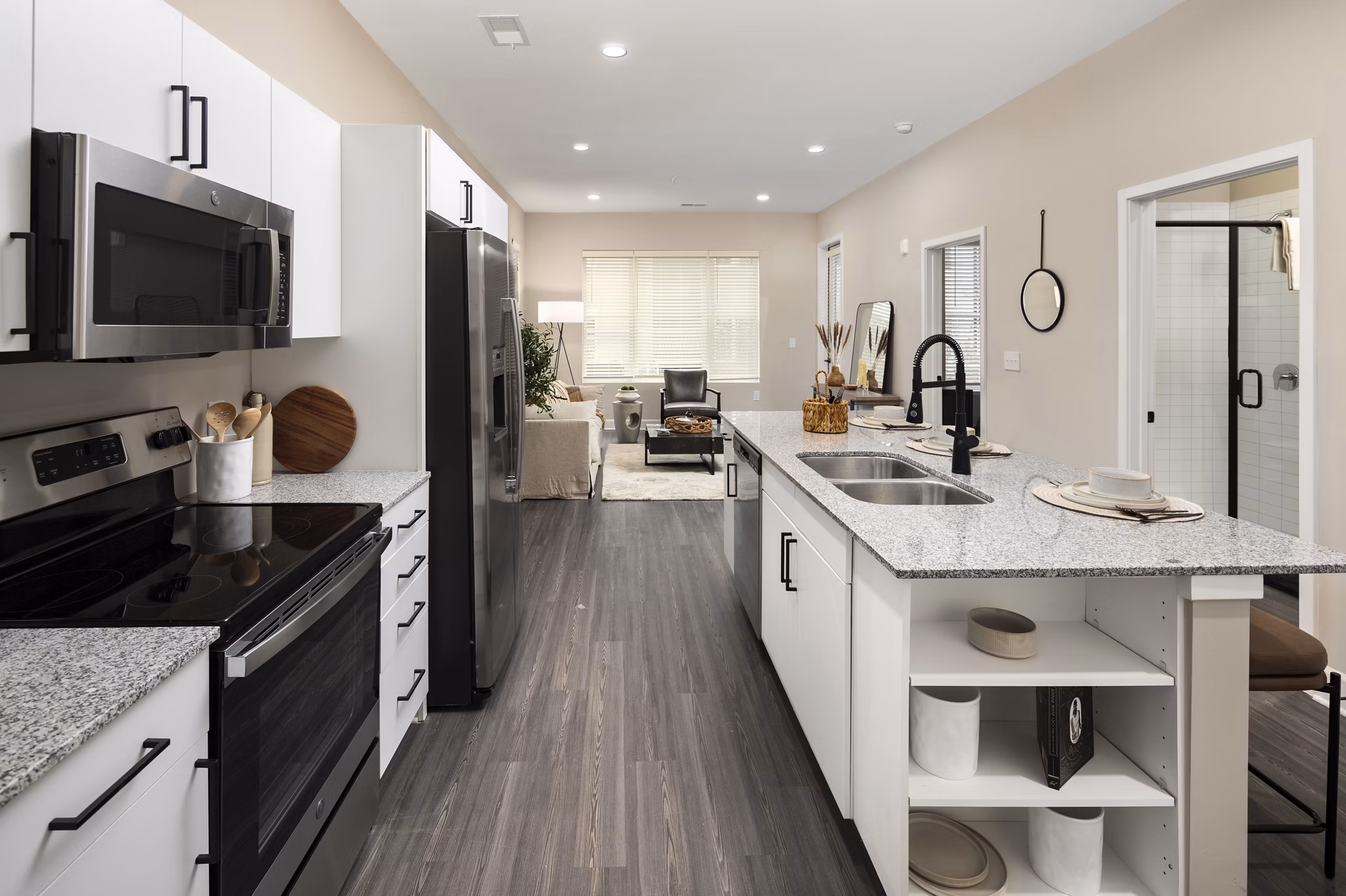 Modern kitchen with stainless steel appliances at The Crossings Apartments