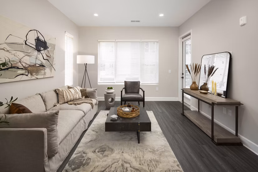 Spacious living room with stylish decor in The Crossings Apartments