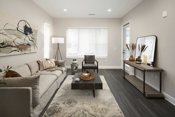 Spacious living room with stylish decor in The Crossings Apartments