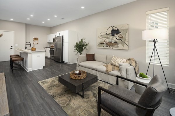 Living room with modern decor and natural light at The Crossings Apartments