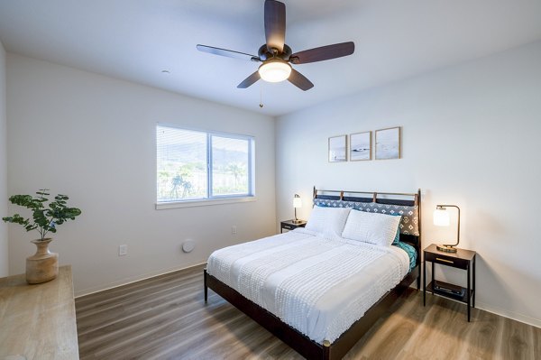 Cozy bedroom with modern decor in Kaulana Mahina Apartments