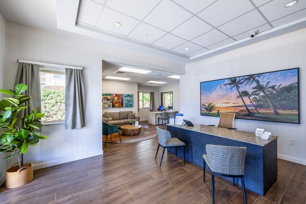 Clubhouse featuring modern design and comfortable seating at Kaulana Mahina Apartments, a luxury property by Greystar in a prime location
