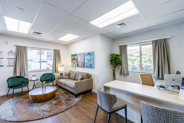 Modern clubhouse and leasing office at Kaulana Mahina Apartments, featuring luxury amenities and stylish design, perfect for resident gatherings
