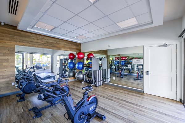 State-of-the-art fitness center at Kaulana Mahina Apartments featuring modern exercise equipment and spacious workout areas for residents