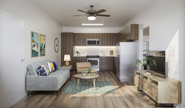 Modern living room with sleek furniture and ocean views at Kaulana Mahina Apartments