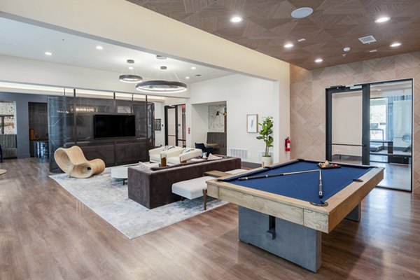 Clubhouse with modern furnishings at The International at Valley Ranch Apartments