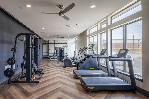 State-of-the-art fitness center featuring modern equipment at The International at Valley Ranch Apartments