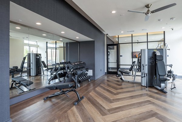 Modern fitness center with state-of-the-art equipment at The International at Valley Ranch Apartments
