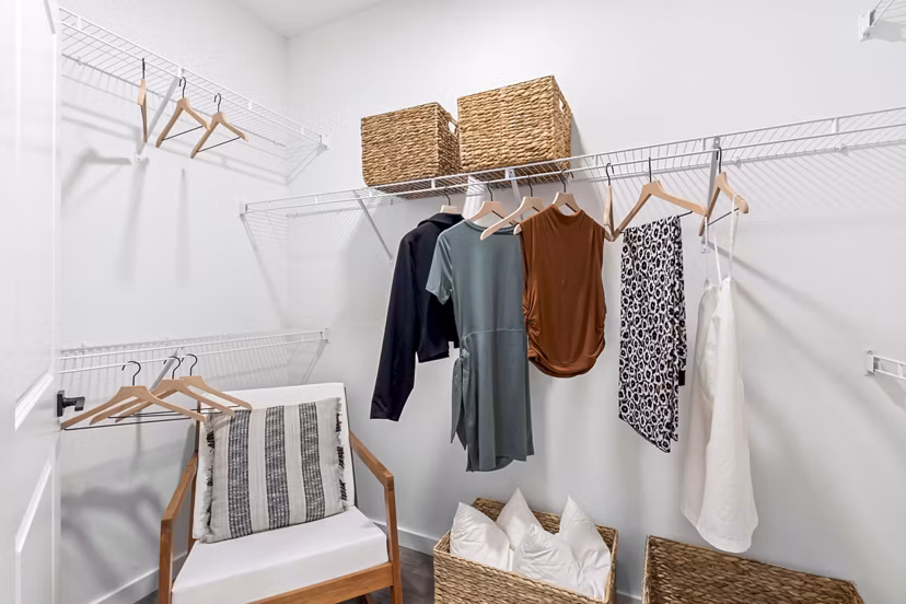 Spacious closet in a modern bedroom at Soluna Apartments, featuring ample storage and sleek design