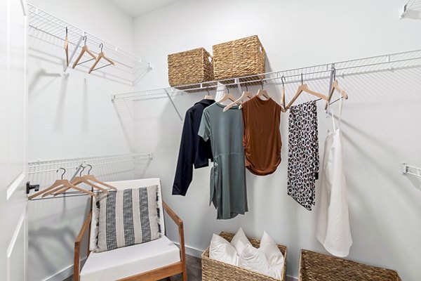 Spacious closet in a modern bedroom at Soluna Apartments, featuring ample storage and sleek design