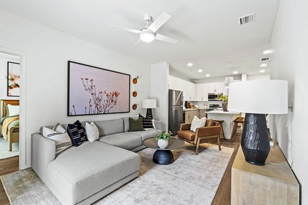 Contemporary living room featuring sleek furniture and vibrant decor at Soluna Apartments