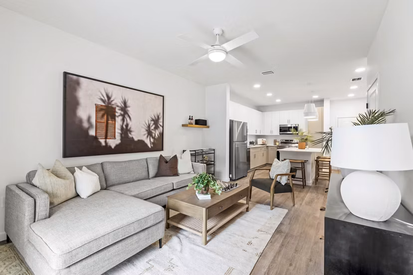 Spacious living room with modern furnishings at Soluna Apartments, luxury property by Greystar