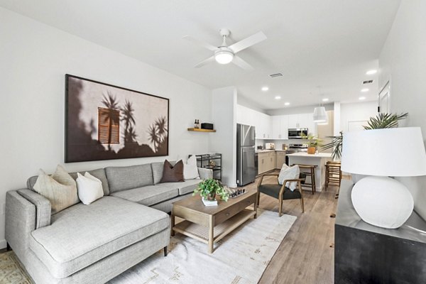 Spacious living room with modern furnishings at Soluna Apartments, luxury property by Greystar