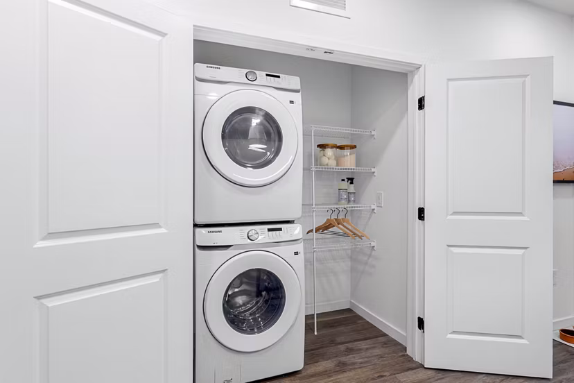Modern laundry room featuring state-of-the-art machines in Soluna Apartments