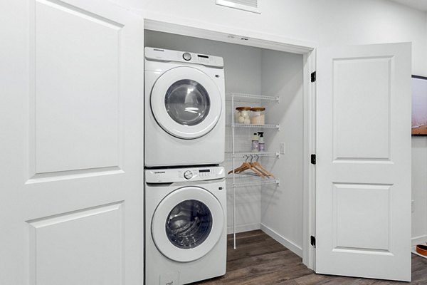 Modern laundry room featuring state-of-the-art machines in Soluna Apartments