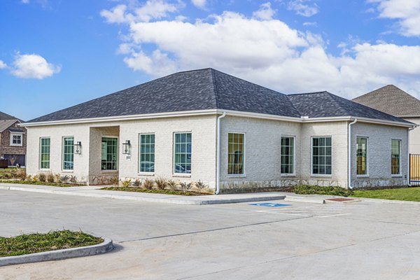 Clubhouse featuring modern dÃ©cor and seating at Balcara at Meridiana Homes apartments
