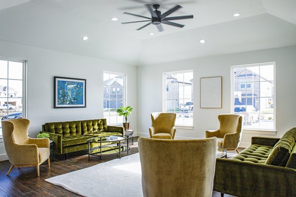 Clubhouse featuring modern design and ample seating at Balcara at Meridiana Homes